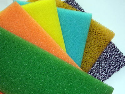 What material is the scouring pad and why is it strong in detergency?